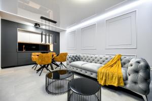 a living room with a couch and a table at Sigma Exclusive Apartment in Zadar