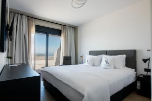 Posteľ alebo postele v izbe v ubytovaní Sivota Legacy Luxury Villas