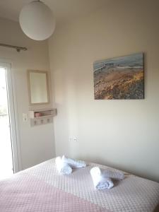 A bed or beds in a room at Casa Plumeria at Gouves Beach