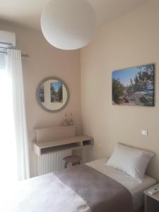 A bed or beds in a room at Casa Plumeria at Gouves Beach