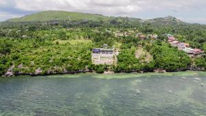 an aerial view of a resort on a island in the water at Epic Suites Bohol ADULTS ONLY in Dauis