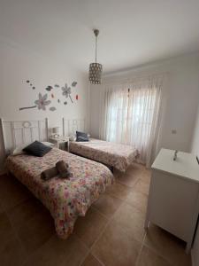 Postel nebo postele na pokoji v ubytování CasadeLanzarote + 18 fotografií