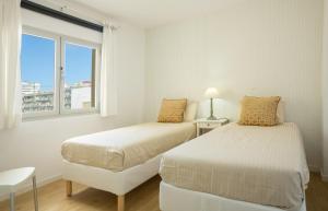 A bed or beds in a room at Mar y Playa de Martín, 2B