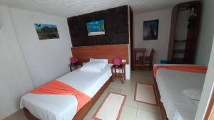 Voodi või voodid majutusasutuse HOSTAL TERO REAL toas