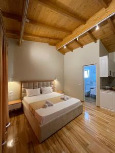 Ένα ή περισσότερα κρεβάτια σε δωμάτιο στο Arial Penthouse Suites
