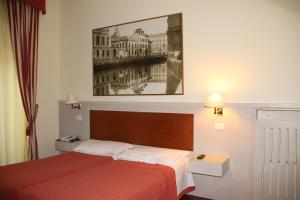 Postel nebo postele na pokoji v ubytování Hotel Rio