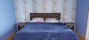 מיטה או מיטות בחדר ב-Tsminda Giorgi Apartment