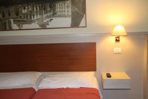 Postel nebo postele na pokoji v ubytování Hotel Rio