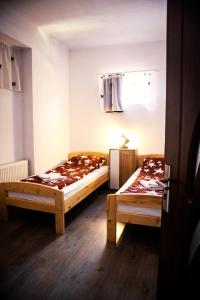 Postel nebo postele na pokoji v ubytování Elekes Apartmans