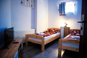 Postel nebo postele na pokoji v ubytování Elekes Apartmans