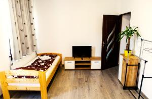 Postel nebo postele na pokoji v ubytování Elekes Apartmans