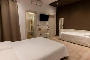 Posteľ alebo postele v izbe v ubytovaní Adrian's B&B