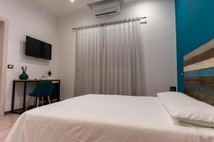 Posteľ alebo postele v izbe v ubytovaní Adrian's B&B