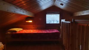 Кровать или кровати в номере Vuosselintähti 8 B