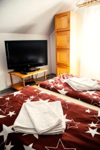 Postel nebo postele na pokoji v ubytování Elekes Apartmans