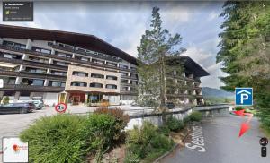 a rendering of a building with a parking lot at Wolfgangsee Seeblickplatzl 119 in Strobl