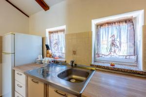Kuchyň nebo kuchyňský kout v ubytování Apartments Villa Bare
