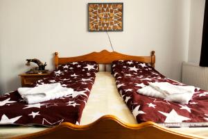 Postel nebo postele na pokoji v ubytování Elekes Apartmans