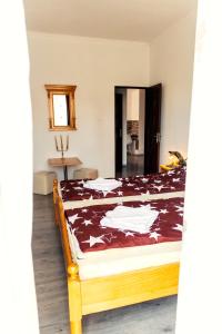 Postel nebo postele na pokoji v ubytování Elekes Apartmans