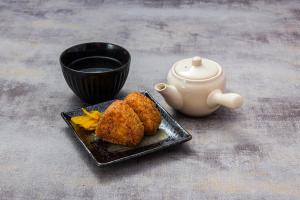 a plate with fried food and a cup of coffee at Koriyama Flower Style in Tenri