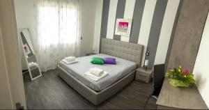 A bed or beds in a room at A Tre Piani Sul Mare