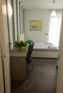 A bed or beds in a room at A Tre Piani Sul Mare
