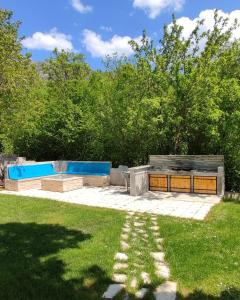 a backyard with a pool and a table and grass at Getaway house Loko in Trebinje