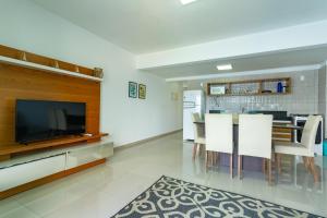 TV a/nebo společenská místnost v ubytování Paraíso Tropical! O mar é sua varanda!