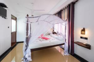 Postel nebo postele na pokoji v ubytování Seaview Deepal villa