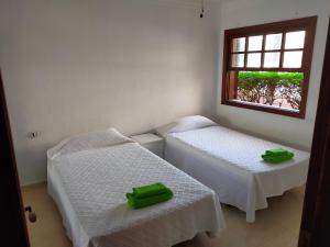 two beds in a room with a window at Apartment South Tenerife in San Miguel de Abona