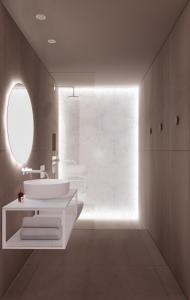 a bathroom with two sinks and a large window at Ostria Inn in Moutsoúna