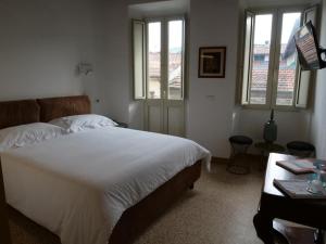 Ένα ή περισσότερα κρεβάτια σε δωμάτιο στο B&B Relais dell'Angelo