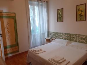 Posteľ alebo postele v izbe v ubytovaní Taormina Center