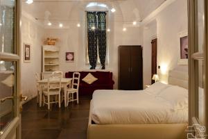 Säng eller sängar i ett rum på Hotel I Somaschi