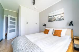Zdjęcie z galerii obiektu Marina Blue - super widok z własnego ogródka na jezioro, parking, Netflix i Max w Iławie