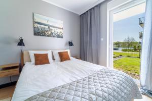 Zdjęcie z galerii obiektu Marina Blue - super widok z własnego ogródka na jezioro, parking, Netflix i Max w Iławie