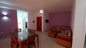 a living room with a table and a couch at Pride of Kelibia in Kelibia