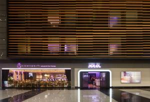 a store in a shopping mall with a large window at YOTEL Istanbul Airport, City Entrance in Istanbul