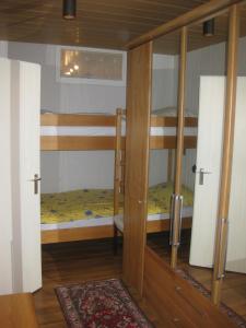 a bedroom with two bunk beds in a room at Haus Nautic 4-3-6 in Kellenhusen