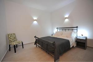 A bed or beds in a room at Blue diamonds villas Paros