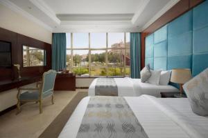 Letto o letti in una camera di Three Points Al Salama
