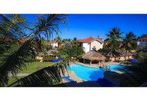 a view of a resort with a swimming pool at Ocean Dream Beachfront Studio with Balcony in Cabarete +11 photos
