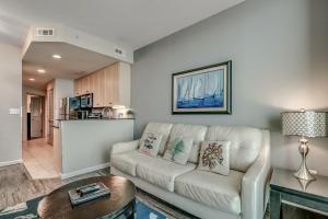 a living room with a couch and a table at Newly Renovated Ocean Front Condo, Modern Decor, Central MB, 20th floor in Myrtle Beach