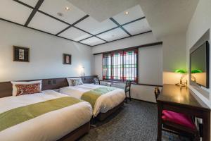 Postel nebo postele na pokoji v ubytování Hotel Aru Kyoto Sanjo Kiyamachi Do-ri