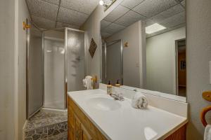 a bathroom with a white sink and a shower at Arrowhead Falls in Clayton +32 photos