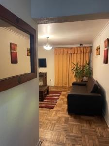 a living room with a couch and a table at Manso de Velasco in Rancagua