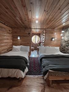 Un pat sau paturi într-o cameră la The Shire of Sagada