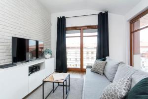 Grey Rentyear Apartments tesisinde bir oturma alanı