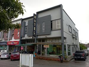 a building on a street with cars parked in a parking lot at D LAYARAN KUANTAN LPT Exit 833 in Kuantan
