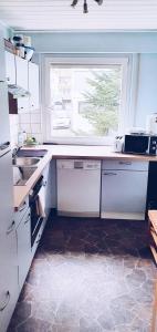a kitchen with a sink and a window at Apartment to stay in Wernau